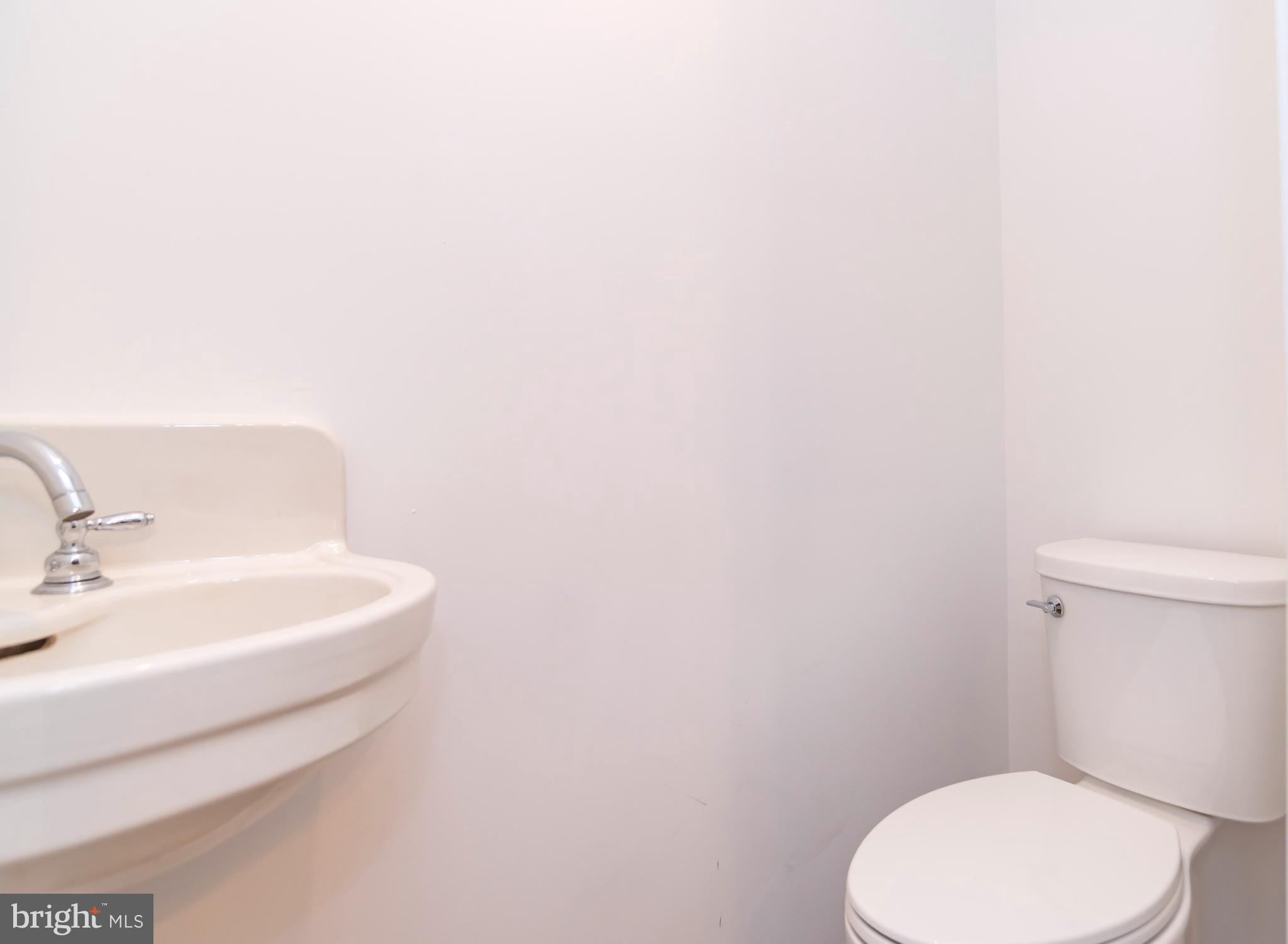 44 Elm Lane Levittown, PA 19054 - Photo 10 of 35 a white toilet sitting next to a white sink