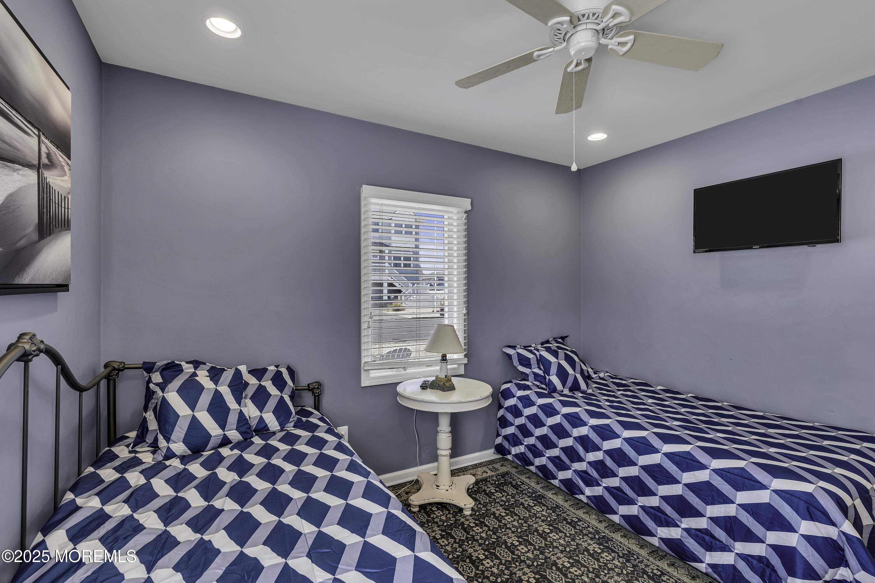 5 Dover Avenue Lavallette, NJ 08735 - Photo 14 of 21 a bedroom with a bed and a chandelier