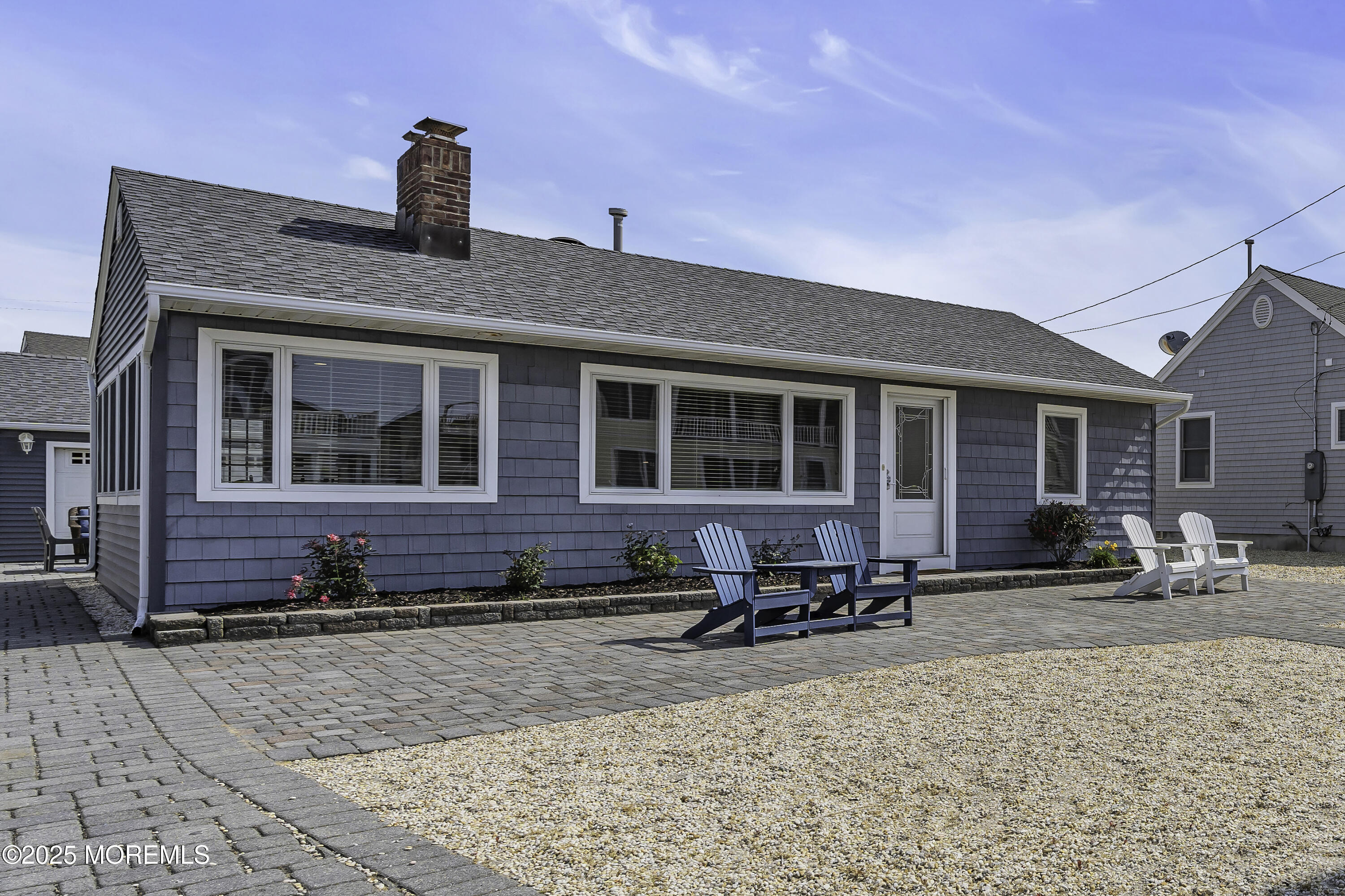 5 Dover Avenue Lavallette, NJ 08735 - Photo 3 of 21 a view of a brick house with many windows
