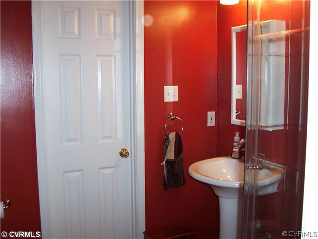 10409 White Rabbit Road North Chesterfield, VA 23235 - Photo 17 of 23 a bathroom with a sink and a mirror