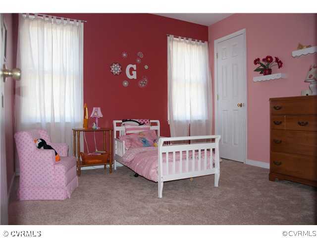 10409 White Rabbit Road North Chesterfield, VA 23235 - Photo 21 of 23 a room with a baby crib and a dresser