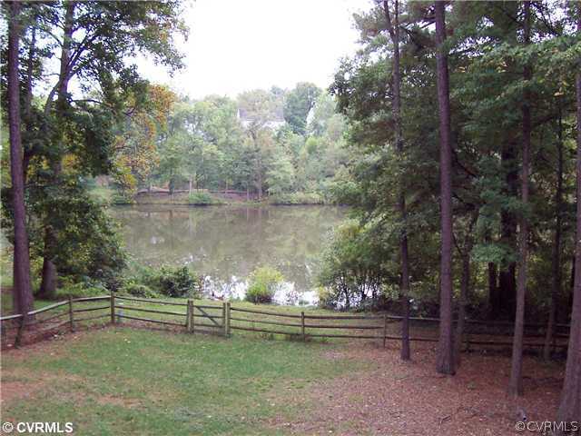 10409 White Rabbit Road North Chesterfield, VA 23235 - Photo 3 of 23 a view of a lake from a yard