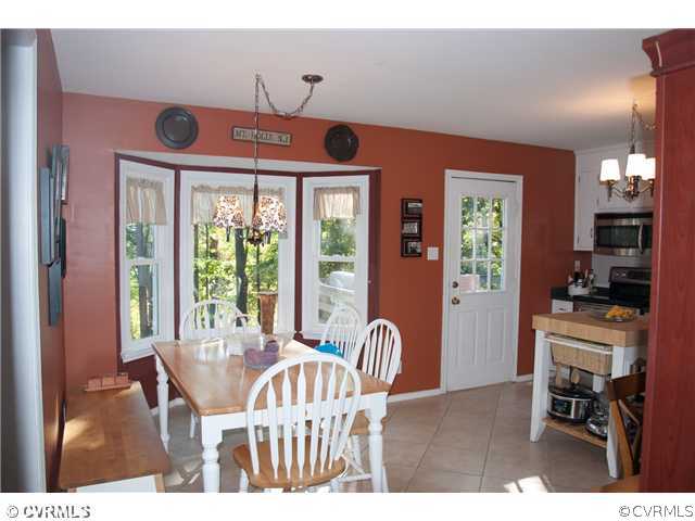 10409 White Rabbit Road North Chesterfield, VA 23235 - Photo 6 of 23 a view of a dining room with furniture window and outside view