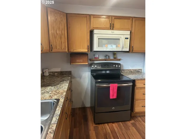 a kitchen with a stove and a microwave