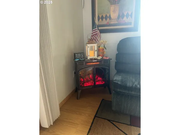 a living room with furniture and wall painting