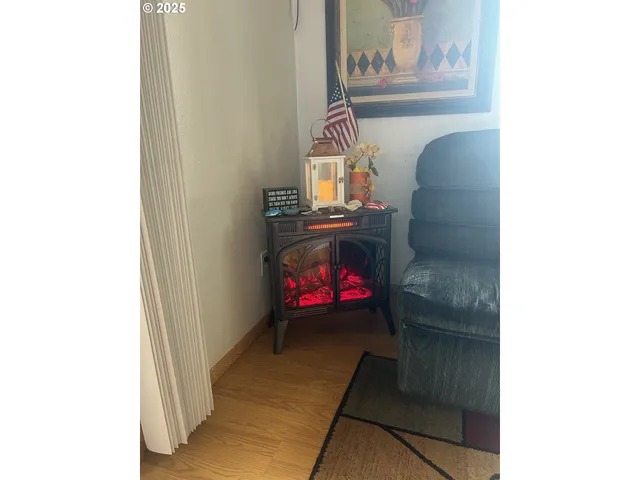 a living room with furniture and wall painting