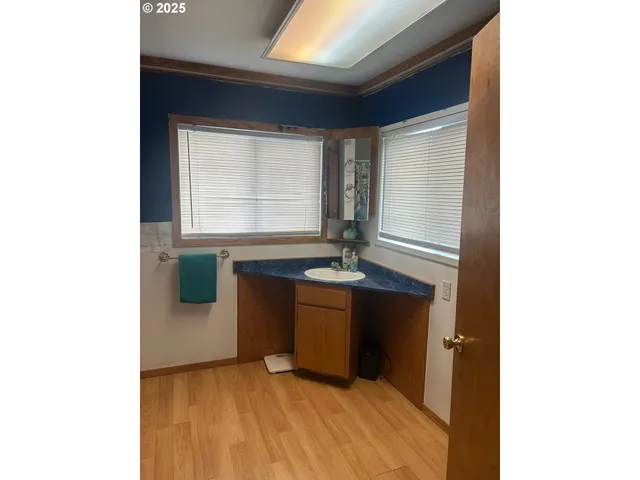 a room with a sink and a window