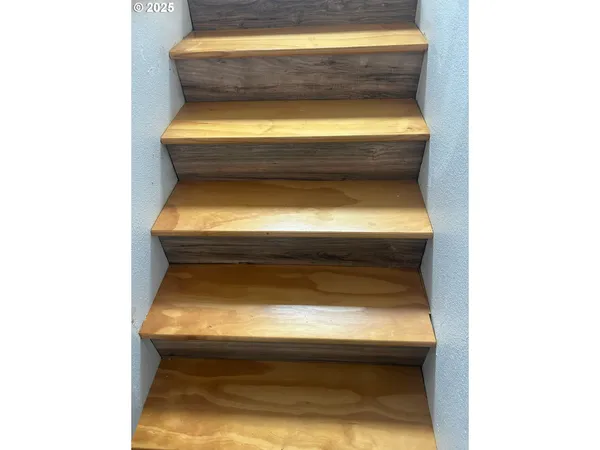 a bathroom with a toilet and tub