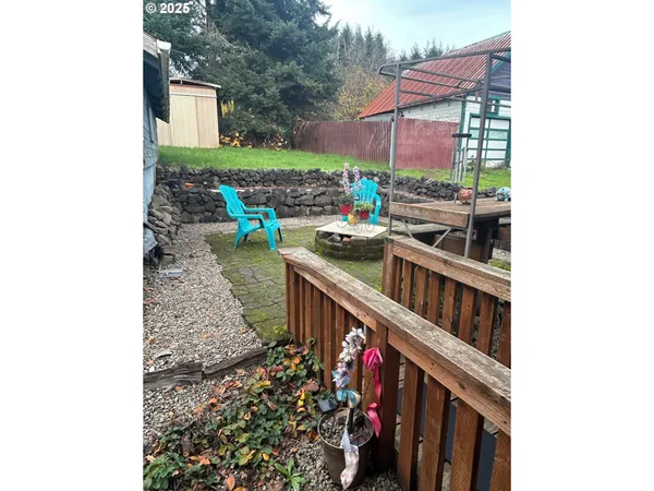 a picture of a tree in front of a house