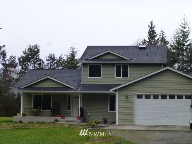 556 Gasman Road Port Angeles, WA 98362 - Photo 7 of 19 a front view of a house with a garden
