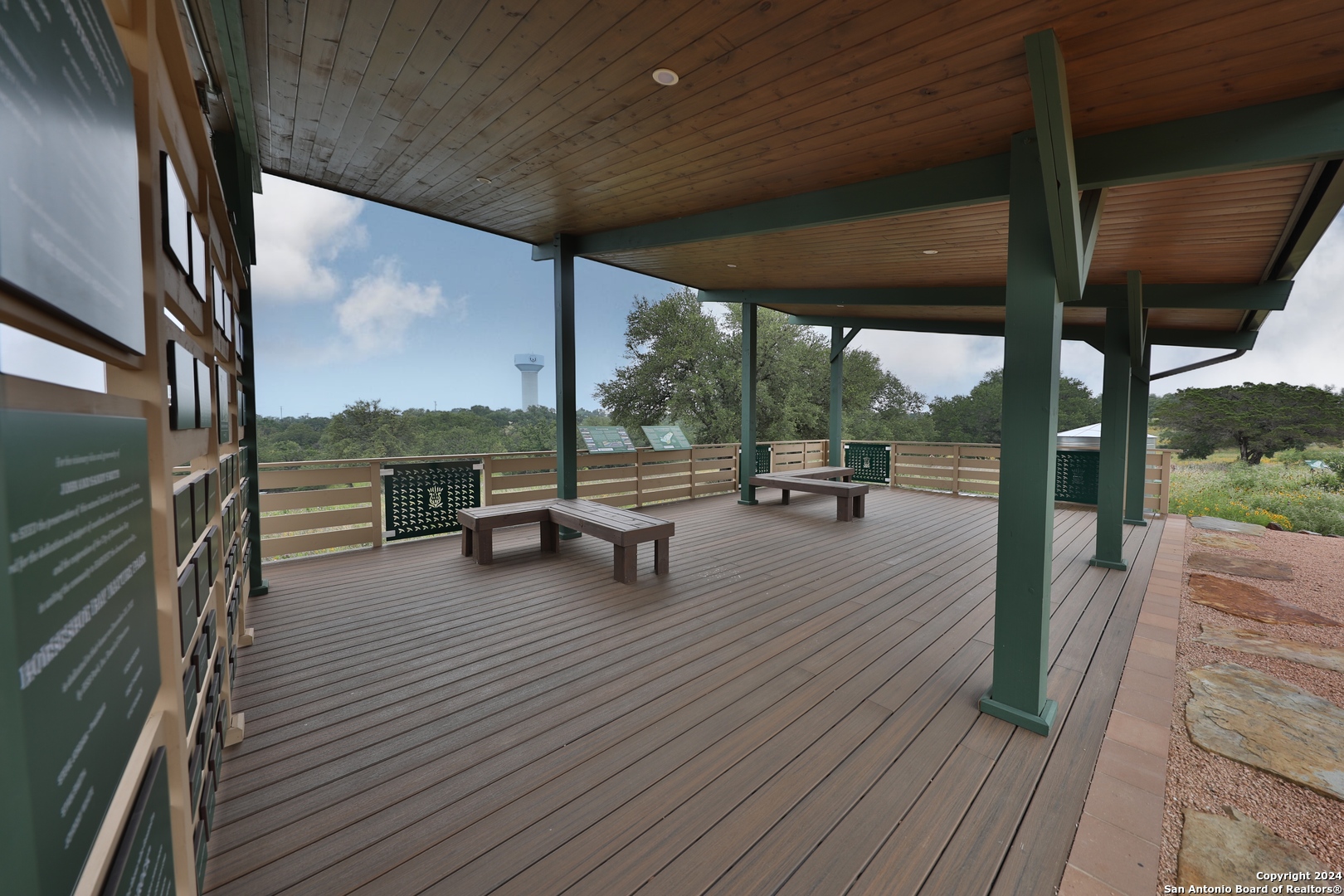 108 Mountain Home Road Horseshoe Bay, TX 78657 - Photo 20 of 22 a view of a deck with wooden floor and outdoor seating