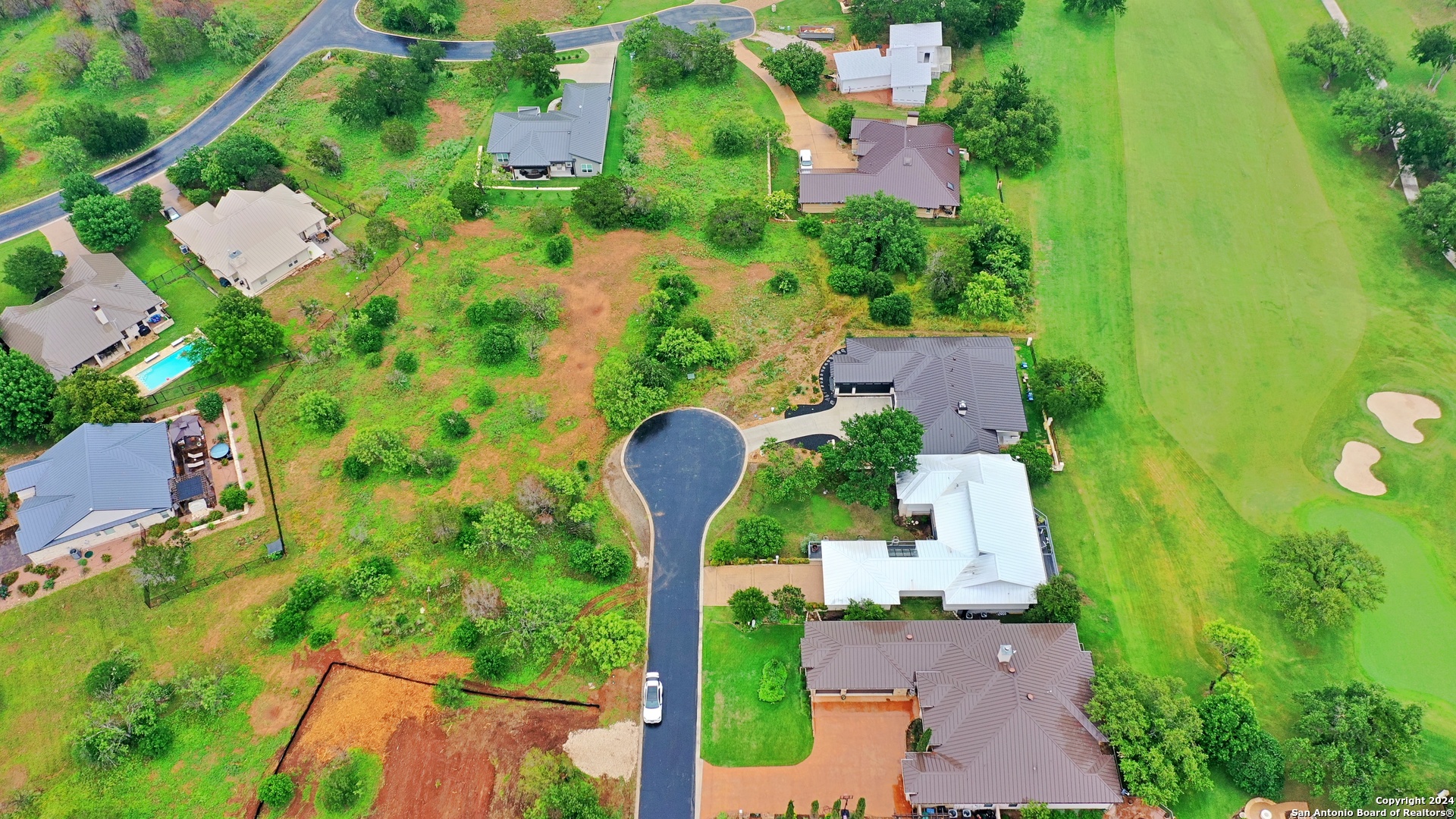 108 Mountain Home Road Horseshoe Bay, TX 78657 - Photo 4 of 22 an aerial view of a house with a yard and lake view