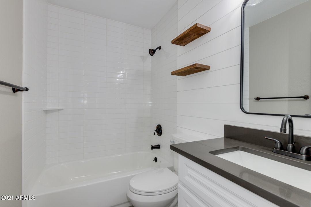 11514 West Larkspur Road El Mirage, AZ 85335 - Photo 13 of 20 a bathroom with a sink a toilet and shower