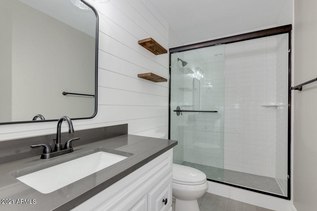 11514 West Larkspur Road El Mirage, AZ 85335 - Photo 17 of 20 a bathroom with a sink and a mirror