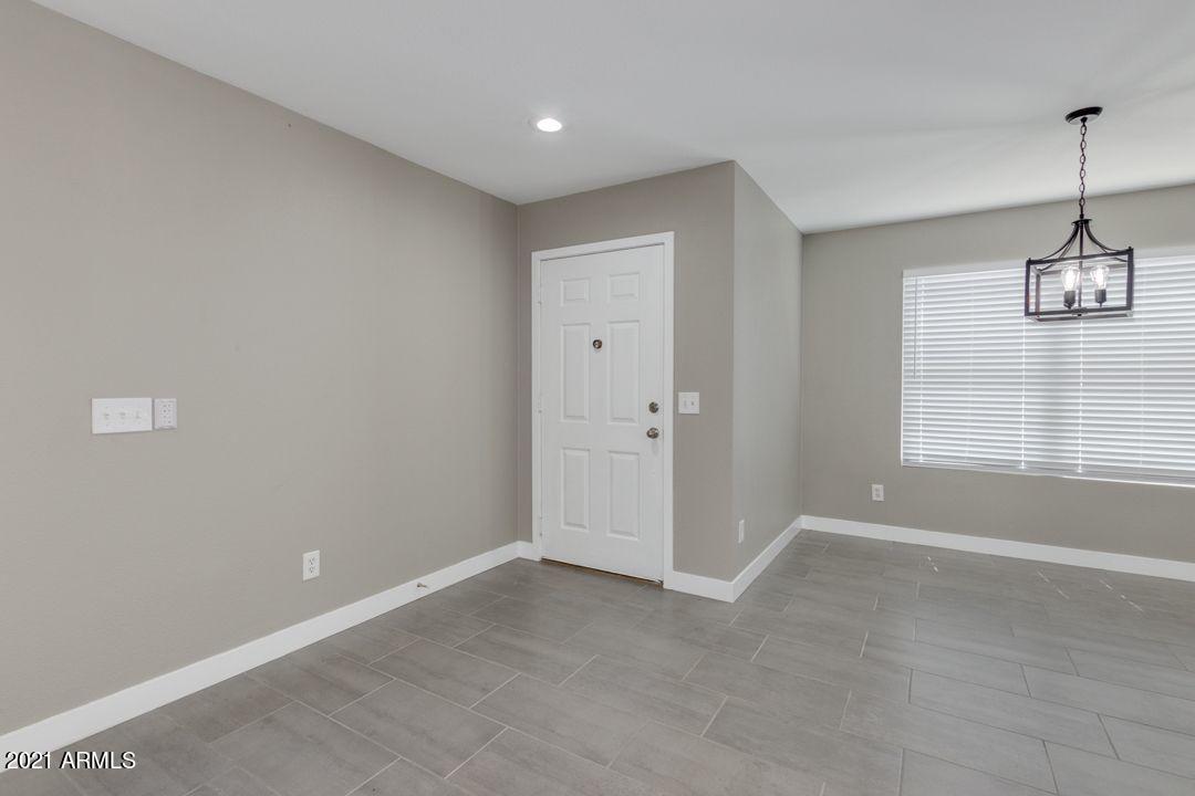 11514 West Larkspur Road El Mirage, AZ 85335 - Photo 2 of 20 a view of an empty room with a window