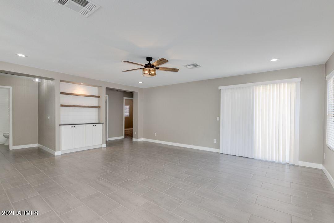 11514 West Larkspur Road El Mirage, AZ 85335 - Photo 3 of 20 a view of an empty room with a window