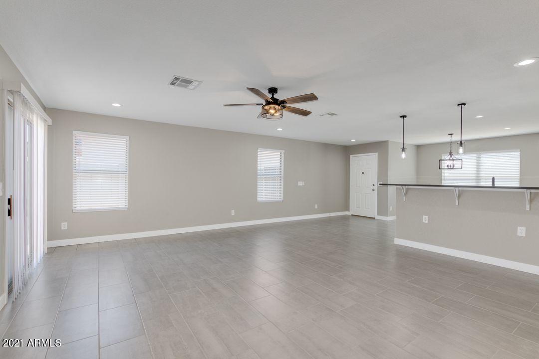 11514 West Larkspur Road El Mirage, AZ 85335 - Photo 4 of 20 a view of an empty room with a window