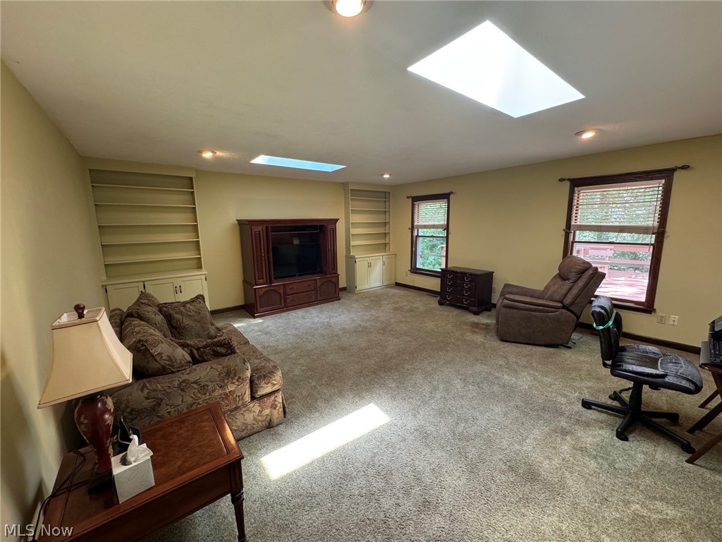 8201 Orchard Road Painesville, OH 44077 - Photo 18 of 45 Carpeted family room with skylights