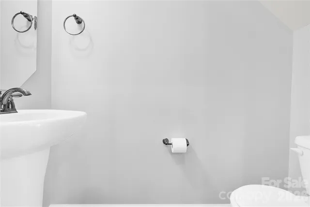 a bathroom with a toilet and a sink