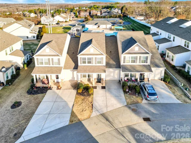 an aerial view of a house with swimming pool