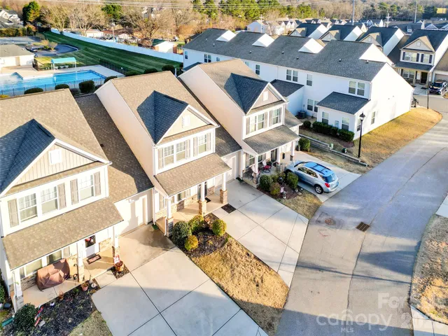 an aerial view of a house with wooden floor