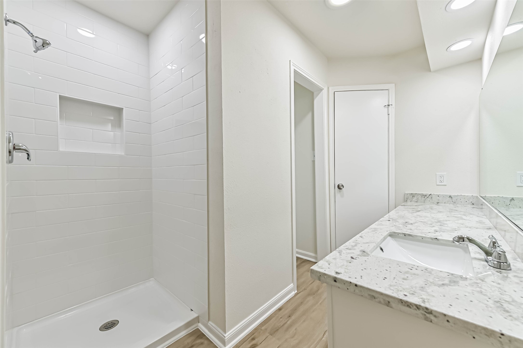 117 Dallas Street Angleton, TX 77515 - Photo 20 of 39 New granite countertops, shower, and toilet in primary bathroom