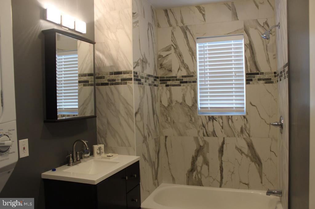 5923 North Broad Street, Unit 1 Philadelphia, PA 19141 - Photo 21 of 25 a bathroom with a sink toilet and shower