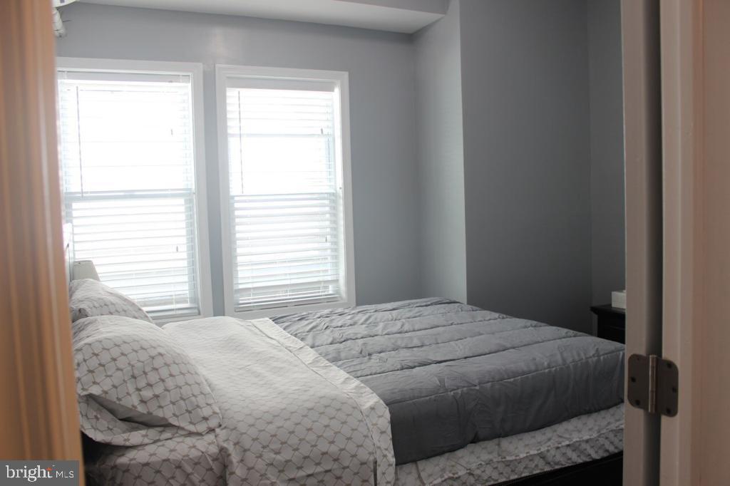 5923 North Broad Street, Unit 1 Philadelphia, PA 19141 - Photo 25 of 25 a bedroom with a bed and a window