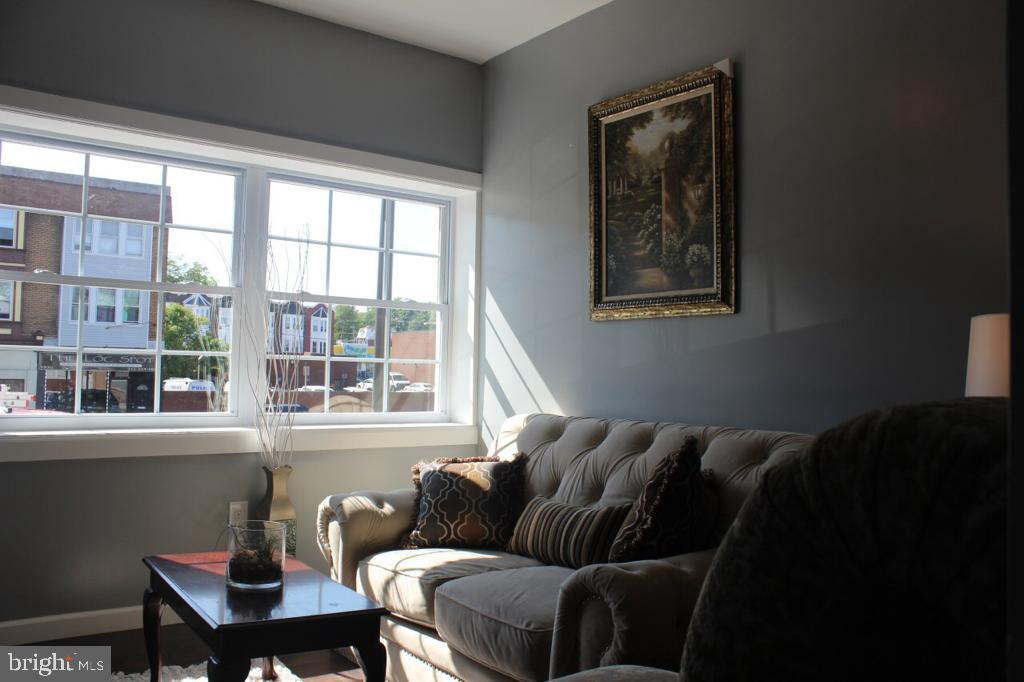 5923 North Broad Street, Unit 1 Philadelphia, PA 19141 - Photo 3 of 25 a living room with furniture and a window
