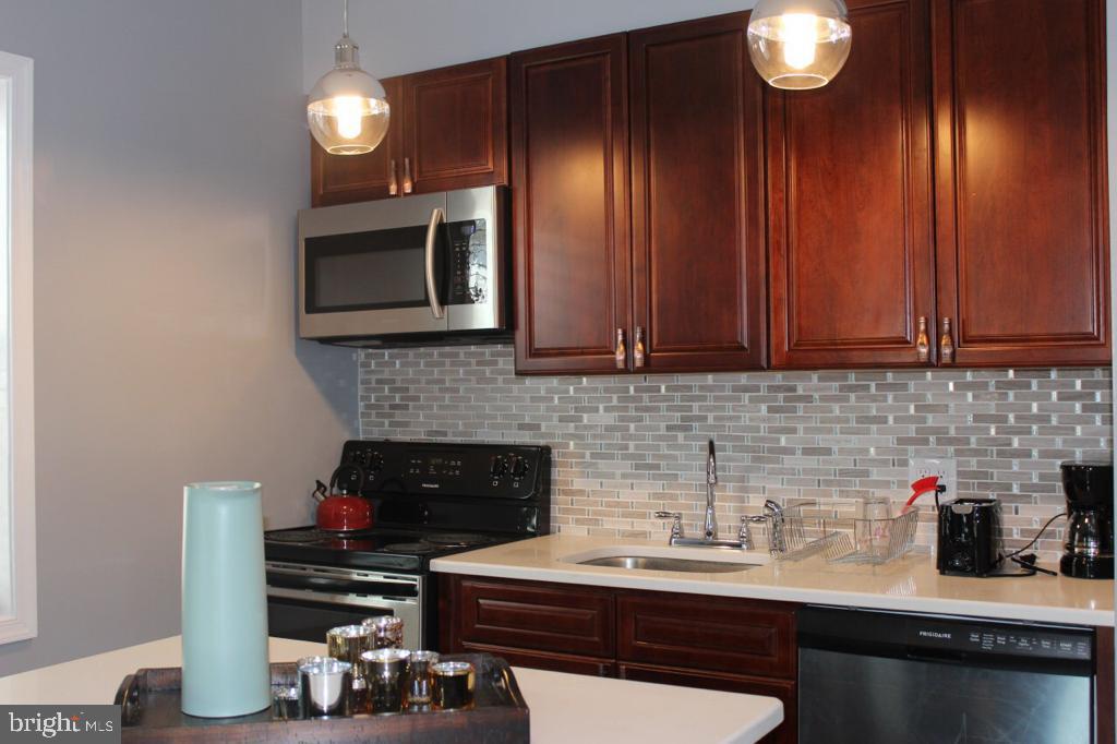 5923 North Broad Street, Unit 1 Philadelphia, PA 19141 - Photo 8 of 25 a kitchen with sink and cabinets