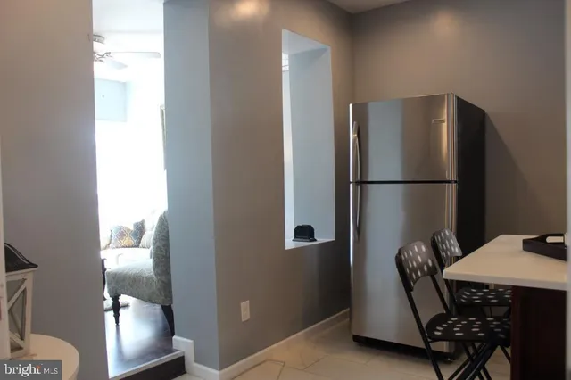 a kitchen with a refrigerator and washer