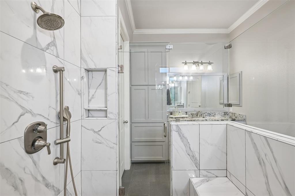1657 Florence Road Keller, TX 76262 - Photo 19 of 40 a bathroom with a double vanity sink a mirror and shower