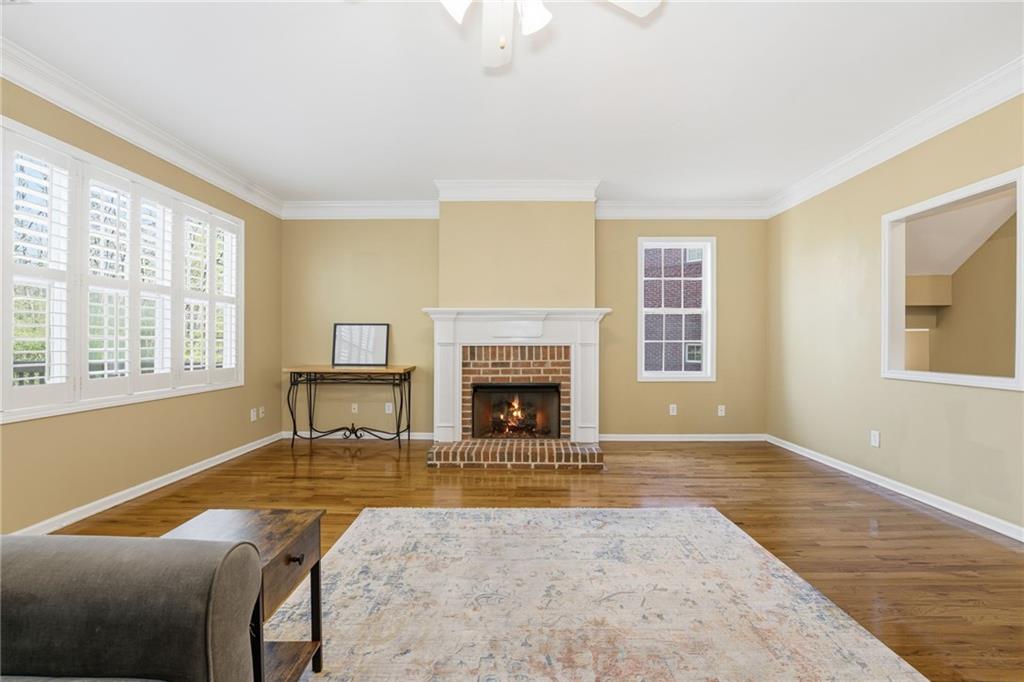 1440 Ferocity Ridge Way Northwest, Unit 17 Kennesaw, GA 30152 - Photo 13 of 42 a living room with furniture and a fireplace