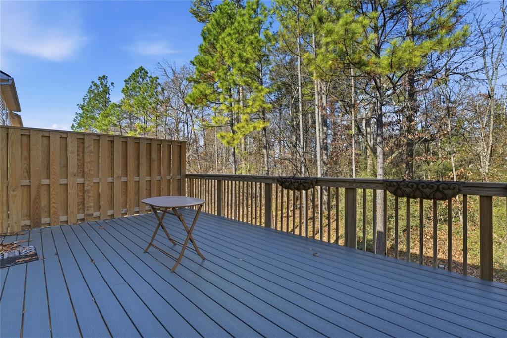 1440 Ferocity Ridge Way Northwest, Unit 17 Kennesaw, GA 30152 - Photo 16 of 42 a view of balcony with wooden floor and outdoor seating