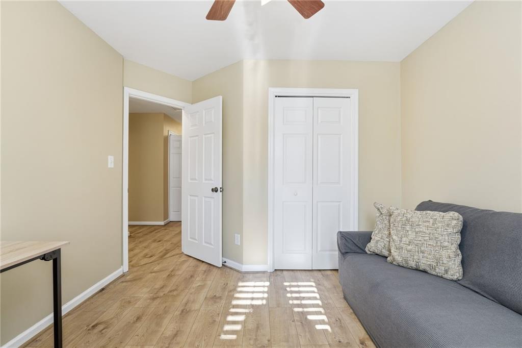 1440 Ferocity Ridge Way Northwest, Unit 17 Kennesaw, GA 30152 - Photo 21 of 42 a living room with furniture and a window