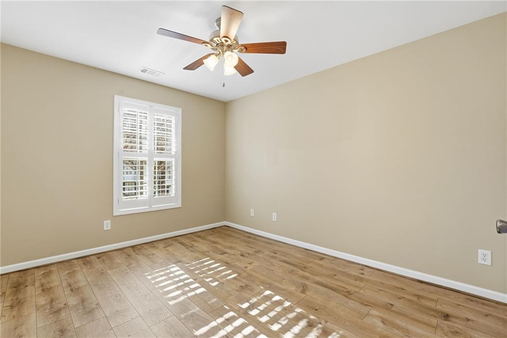 1440 Ferocity Ridge Way Northwest, Unit 17 Kennesaw, GA 30152 - Photo 22 of 42 an empty room with a window