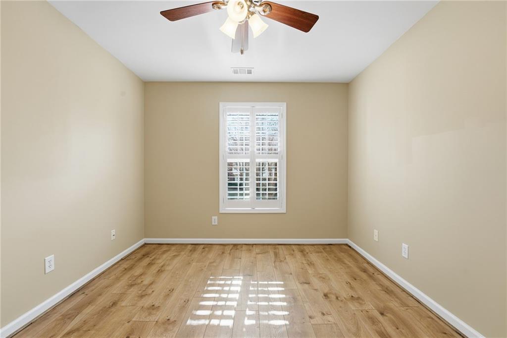 1440 Ferocity Ridge Way Northwest, Unit 17 Kennesaw, GA 30152 - Photo 23 of 42 a view of an empty room with a window