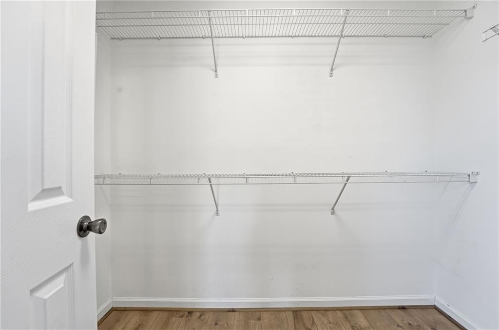 1440 Ferocity Ridge Way Northwest, Unit 17 Kennesaw, GA 30152 - Photo 28 of 42 a view of a room with racks on the wall