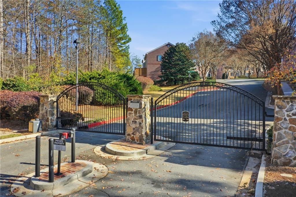 1440 Ferocity Ridge Way Northwest, Unit 17 Kennesaw, GA 30152 - Photo 41 of 42 a view of street along with trees