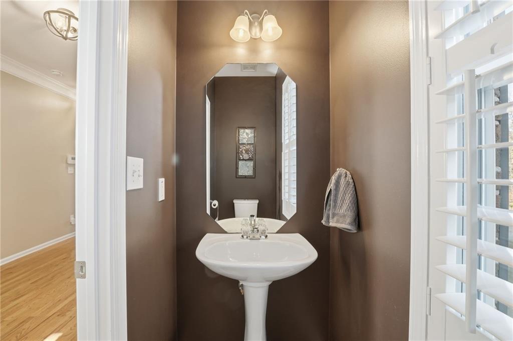 1440 Ferocity Ridge Way Northwest, Unit 17 Kennesaw, GA 30152 - Photo 6 of 42 a bathroom with a sink and a mirror