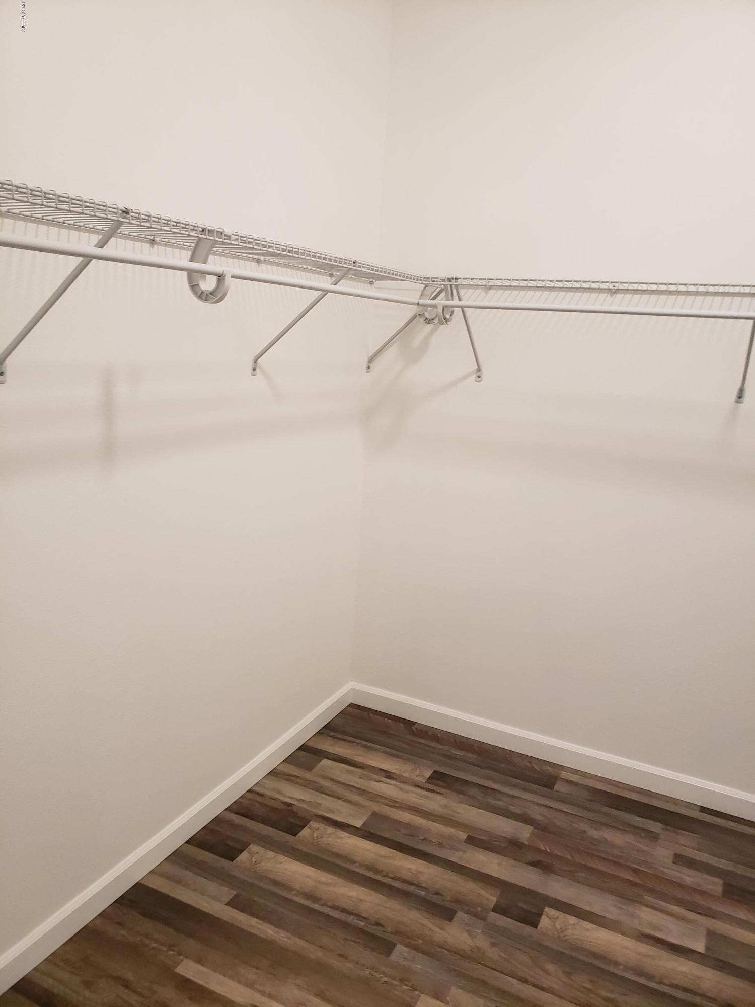 1201 Northwest Crescent Road Sunnyside, WA 98944 - Photo 20 of 35 a view of a room with racks on the wall