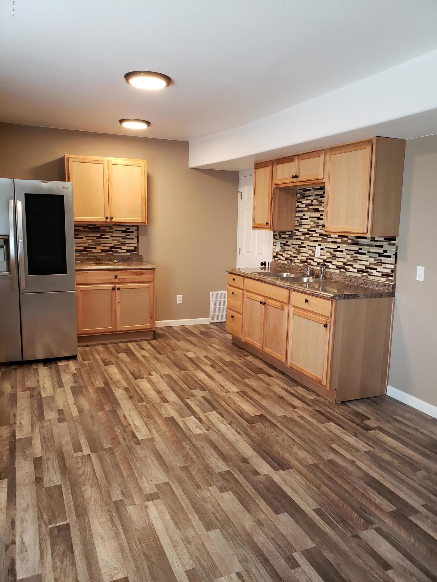 1201 Northwest Crescent Road Sunnyside, WA 98944 - Photo 23 of 35 a kitchen with stainless steel appliances granite countertop a stove and a sink