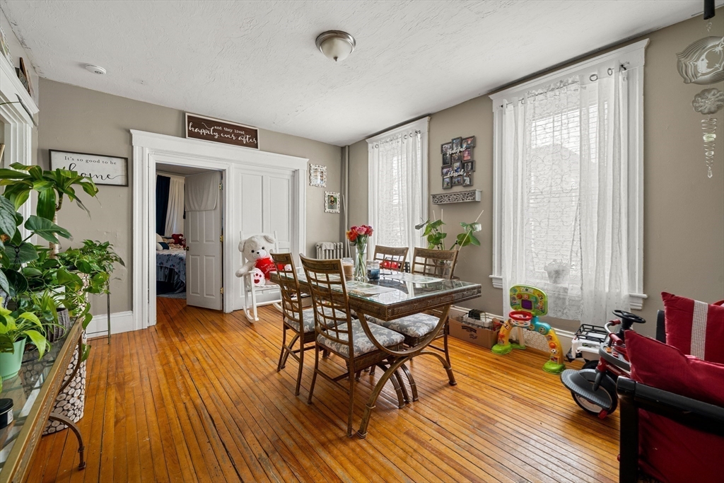 70-72 Russell Street Worcester, MA 01609 - Photo 14 of 30 a view of a livingroom with furniture and a potted plant