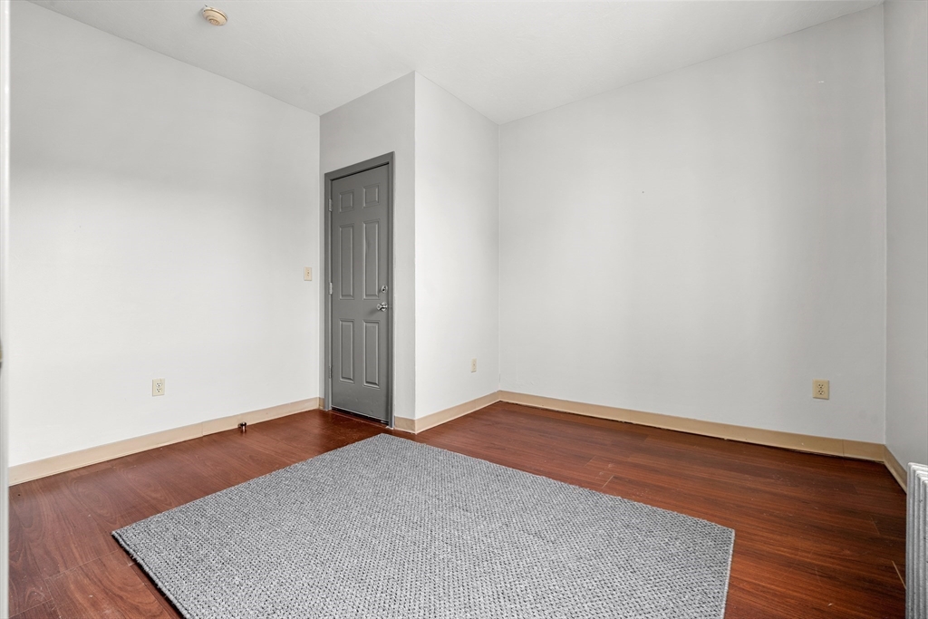 70-72 Russell Street Worcester, MA 01609 - Photo 17 of 30 an empty room with wooden floor