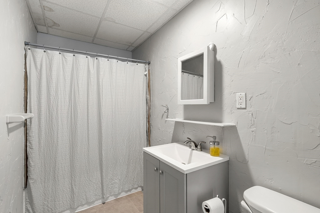 70-72 Russell Street Worcester, MA 01609 - Photo 20 of 30 a bathroom with a sink a toilet and shower
