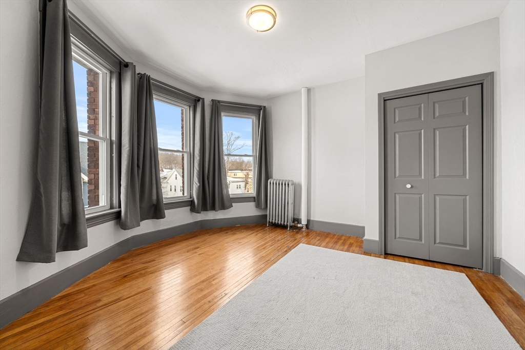 70-72 Russell Street Worcester, MA 01609 - Photo 23 of 30 a view of an empty room with glass door and a window