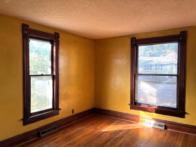 301 South Grape Street Morrison, IL 61270 - Photo 11 of 25 a view of an empty room with wooden floor and a window