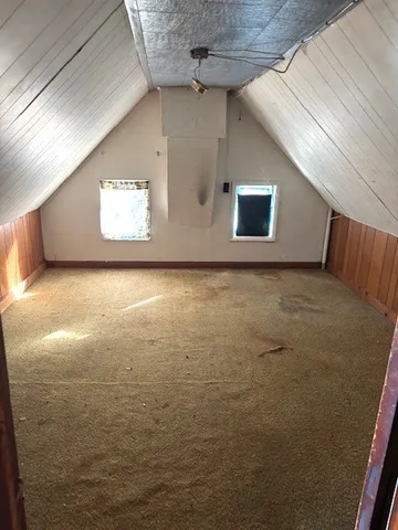 a view of an empty room with windows