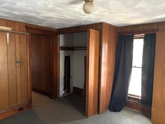 a view of a closet area with en suite bathroom