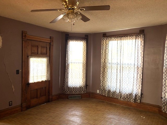 301 South Grape Street Morrison, IL 61270 - Photo 6 of 25 a view of an empty room with a window